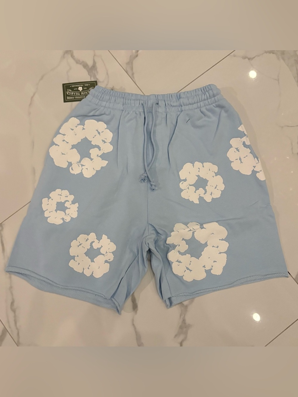 Light blue denim tear shorts